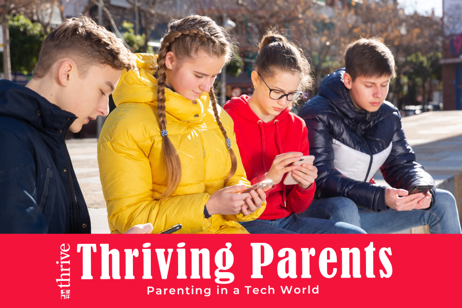 Thrive Thriving Parents: Parenting in a Tech World. Photo of 4 teens sitting outdoors looking at their phones.
